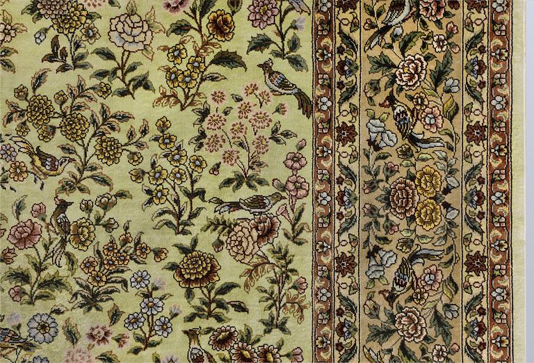 An Oriental silk rug, approx. 124 x 183 cm.