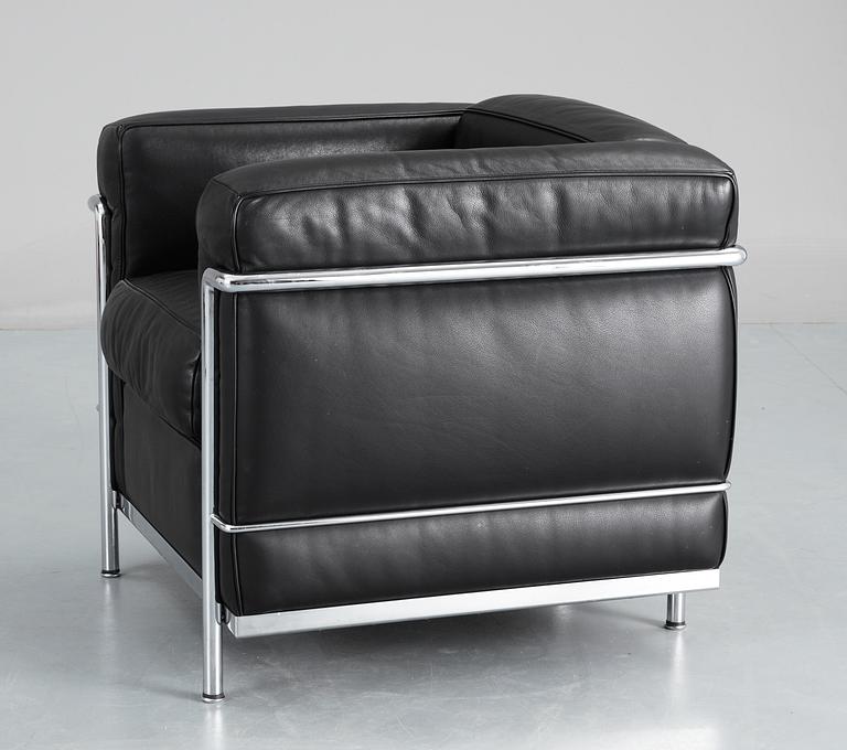 A pair of Le Corbusier 'LC 2' black leather and chromed steel easy chairs, Cassina, Italy.