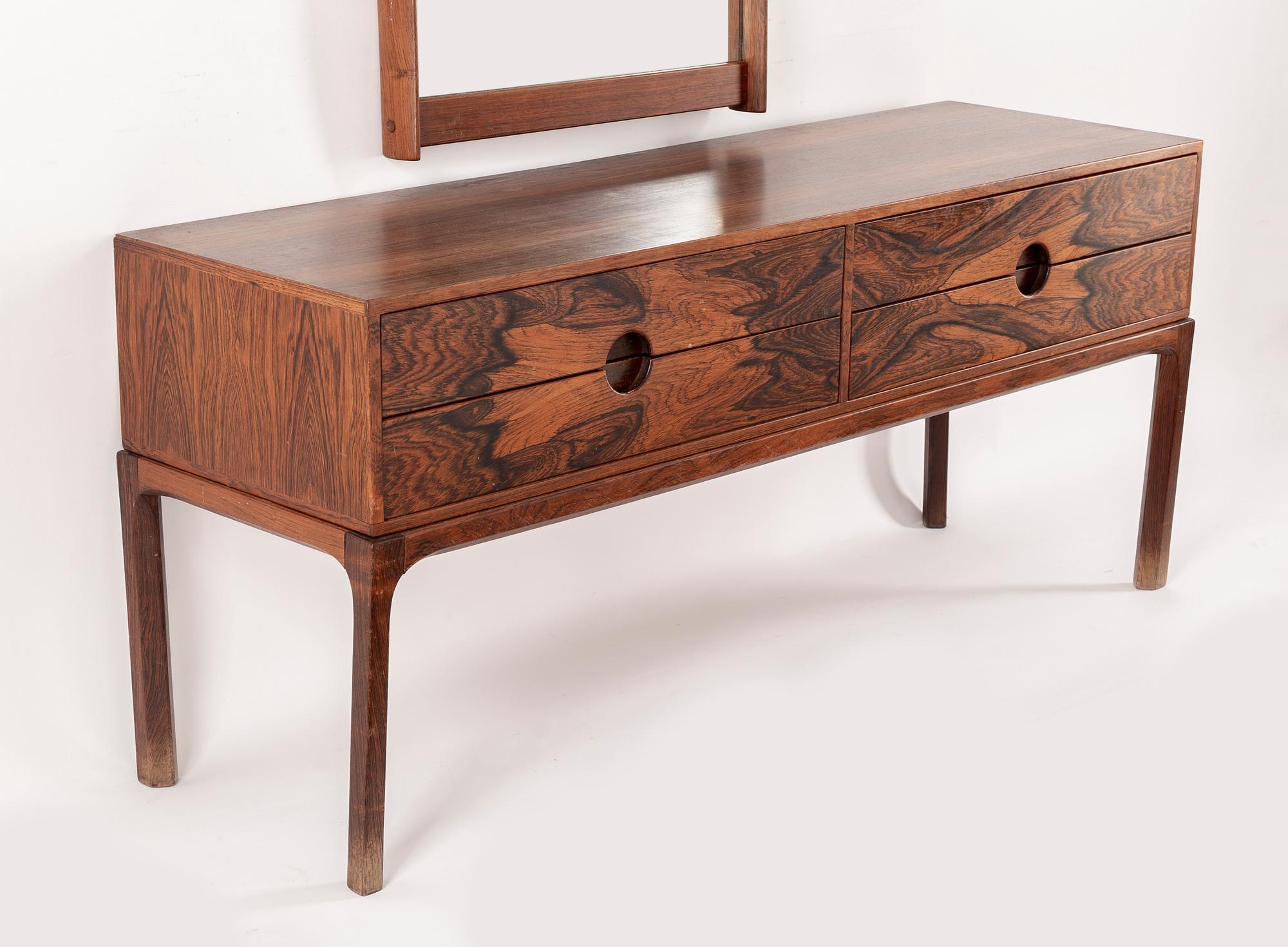 AKSEL KJERSGAARD, a rosewood mirror and chest of drawers from Odder, Denmark, 1960's.