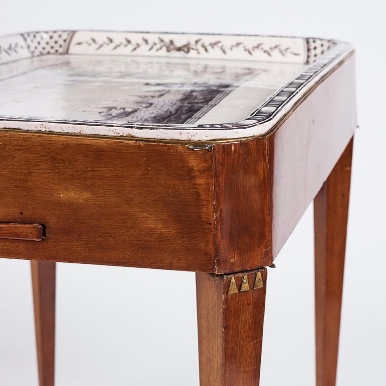 A Gustavian mahogany and faience tea table, late 18th century.