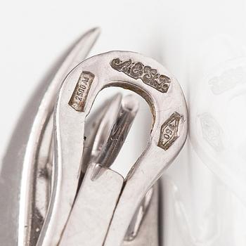 A pair of 18K white gold earrings and a ring with diamonds ca. 0.90 ct in total. Moscow.