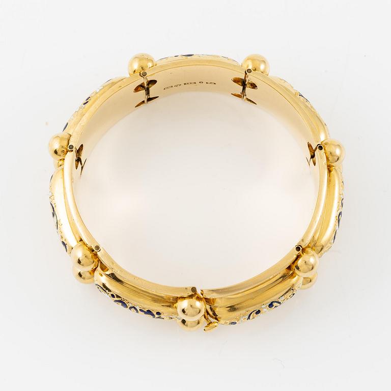 A bracelet 18K gold with enamel details.