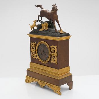 A late empire mantel clock from the first half of the 19th century.