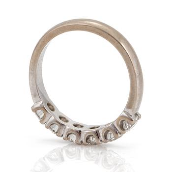 A half-eternity ring set with round, brilliant-cut diamonds.