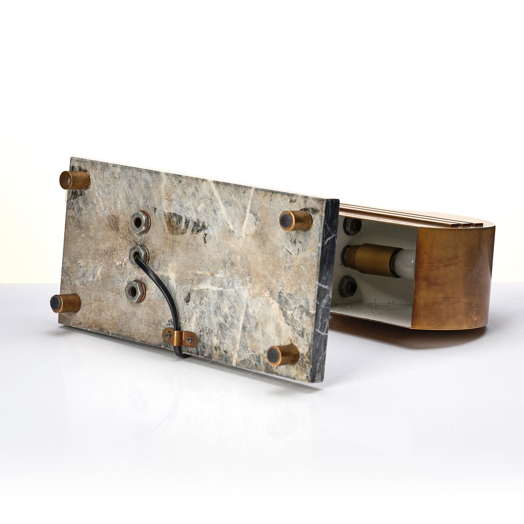 An Austrian brass and black marble table lamp, marked Vienna 1928.