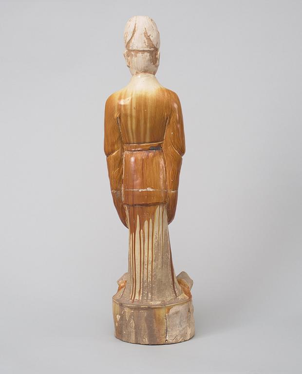 A potted, partially glazed tomb figure of a guardien, Tang dynasty (618-907).