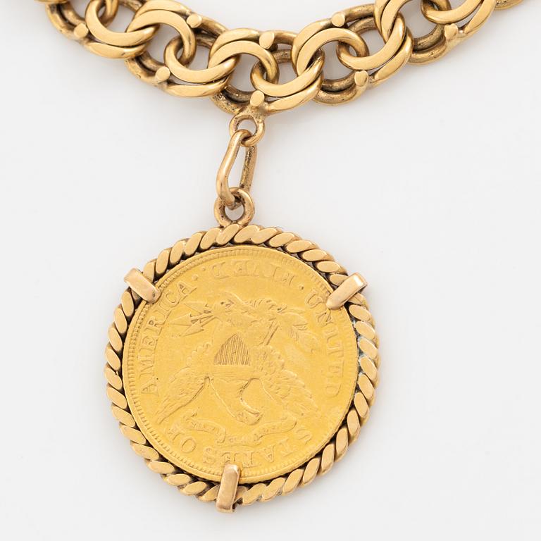Armband guld bismarcklänk med berlocker med guldmynt.