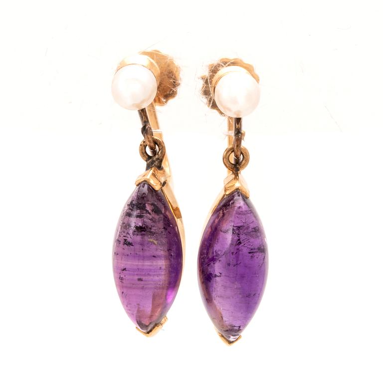 A pair of 18K gold earrings set with cabochon-cut amethysts and seed pearls, Stockholm 1961.