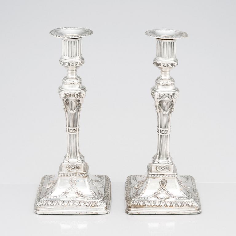 An English pair of 18th Century silver candlesticks, mark of John Winter & Co, Sheffield 1775.