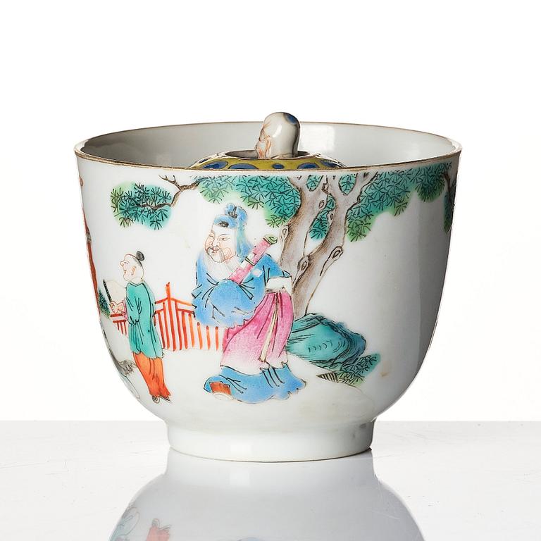 A famille rose 'trick cup' with a little figure, Qing dynasty, 19th Century.