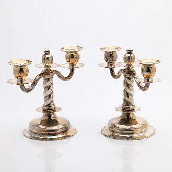 C.G. Hallberg, Pair of candelabra, silver, Stockholm, 1927.