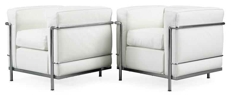 A pair of Le Corbusier, 'LC2' chromed steel and white leather easy chair, Cassina, Italy.