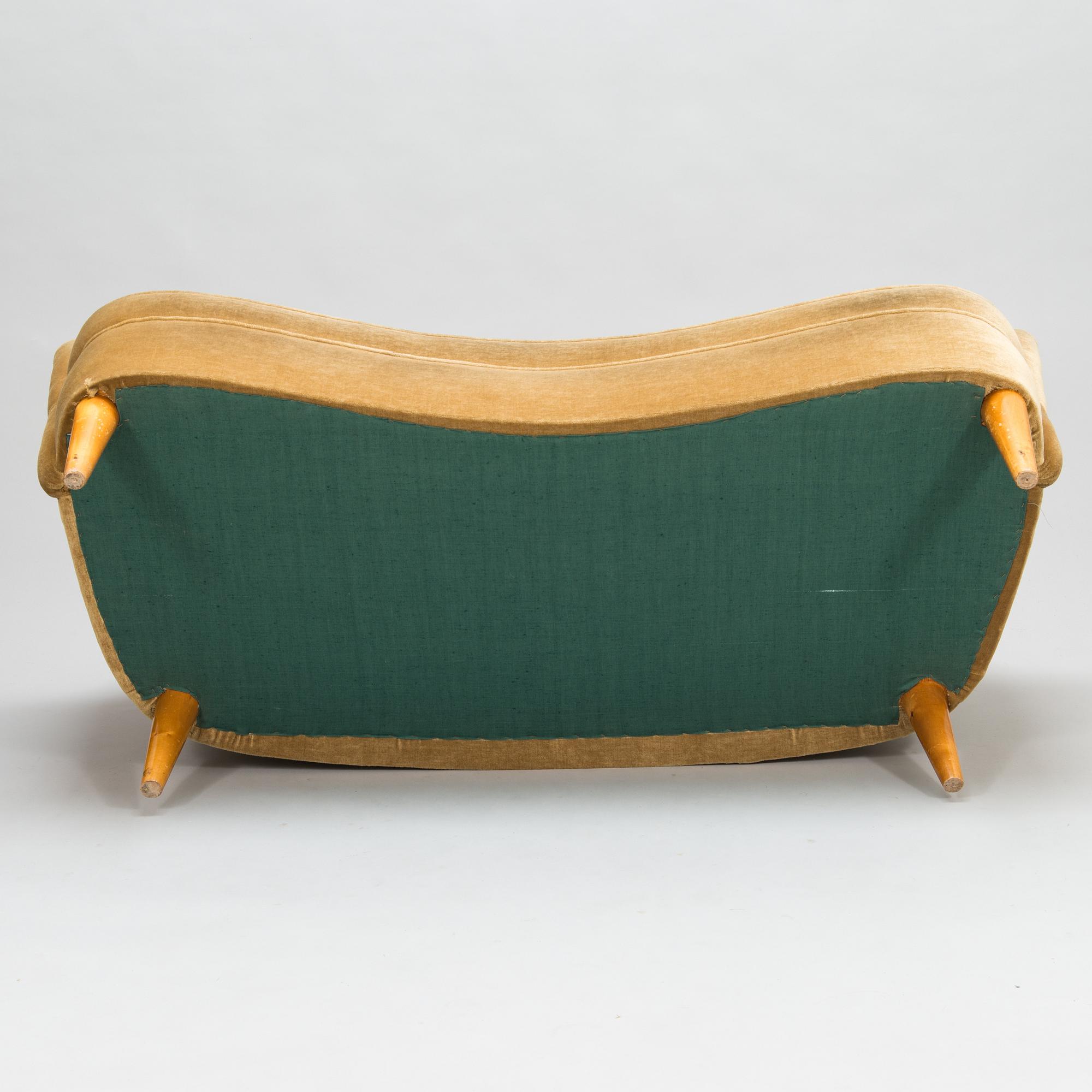 A mid-20th-century sofa and armchair.