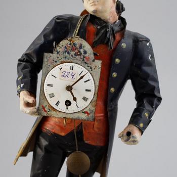 A Black Forest sheet metal figural timepiece, second half of the 19th century.
