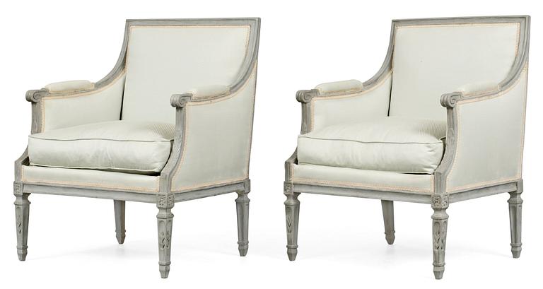 A pair of Louis XVI armchairs.