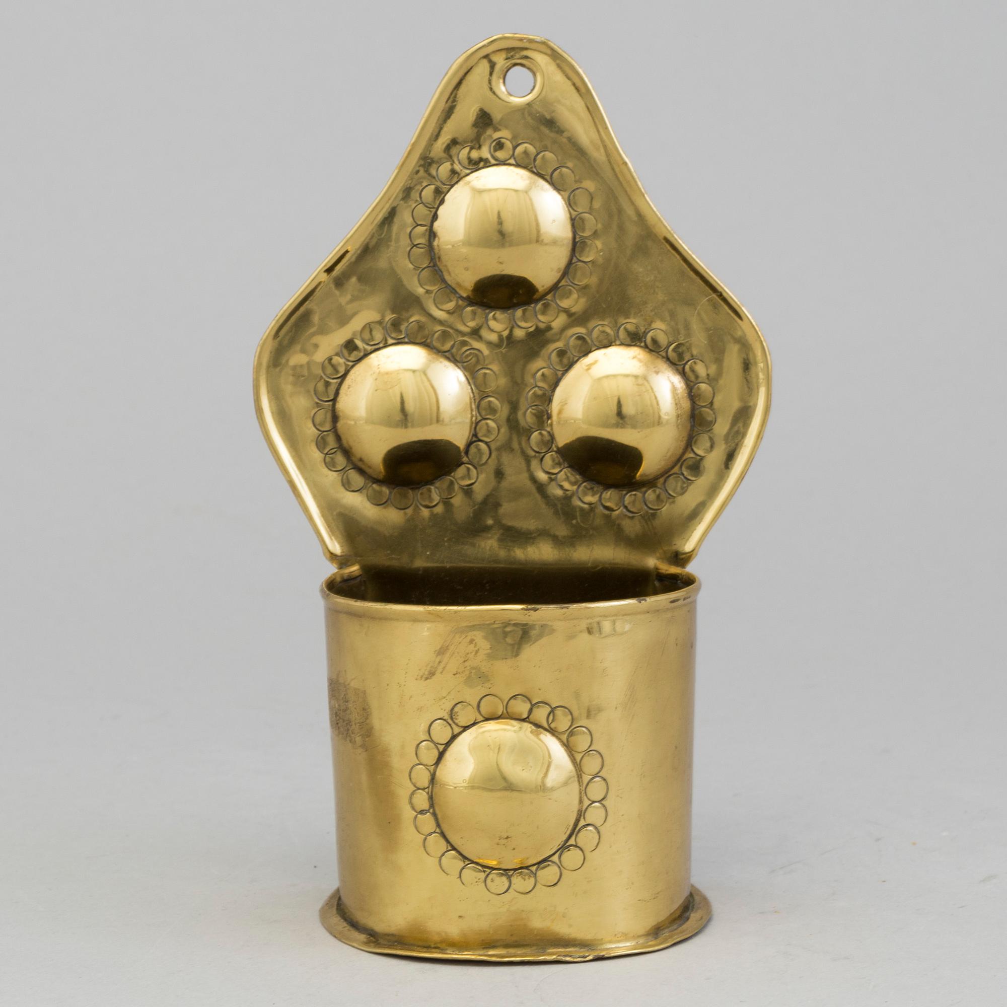 A 19th century brass spoon holder.