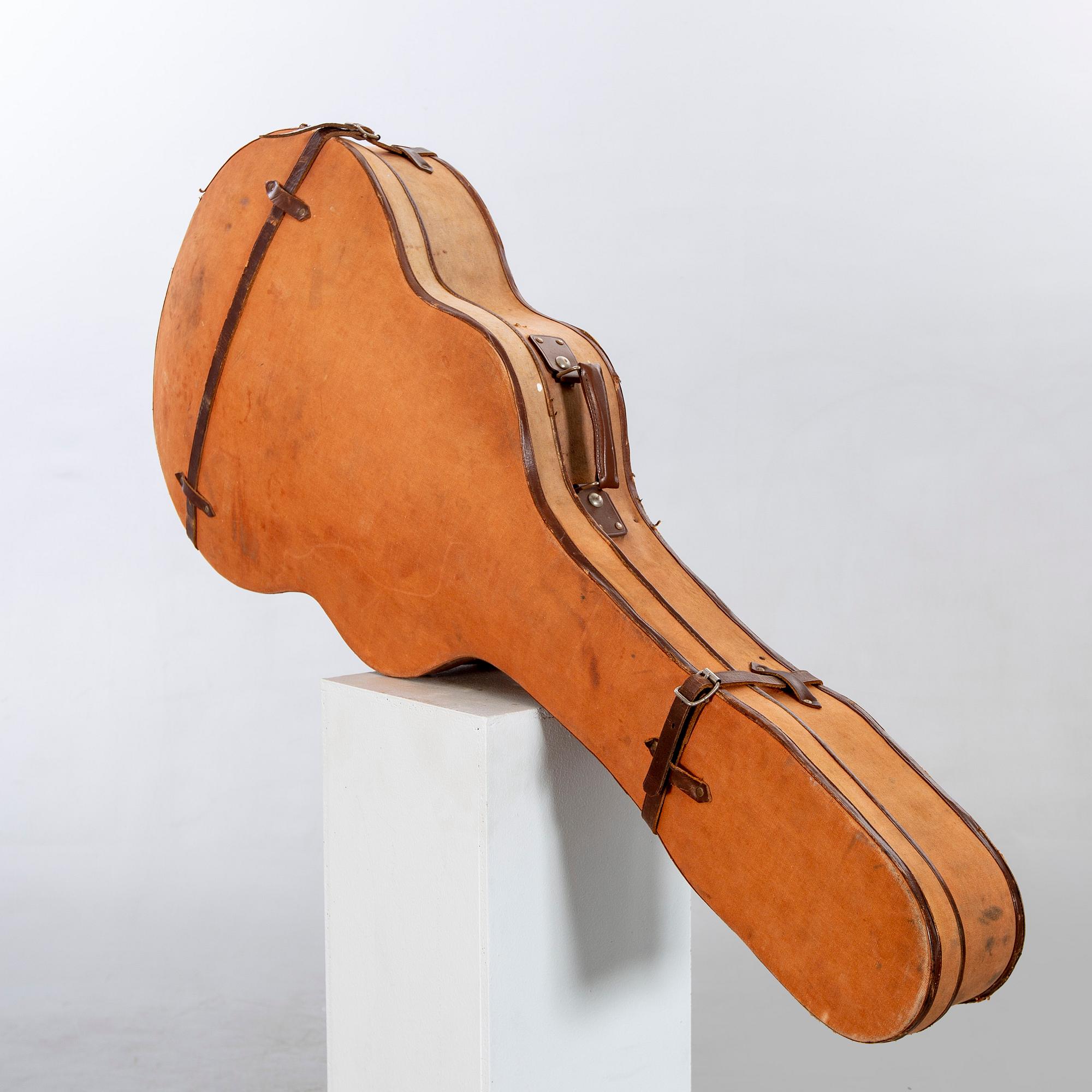 A Crafton Rex acoustic guitar.