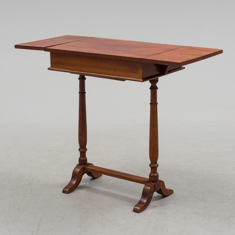 A Swedish first half of the century Karl Johan style mahogany veneered table.