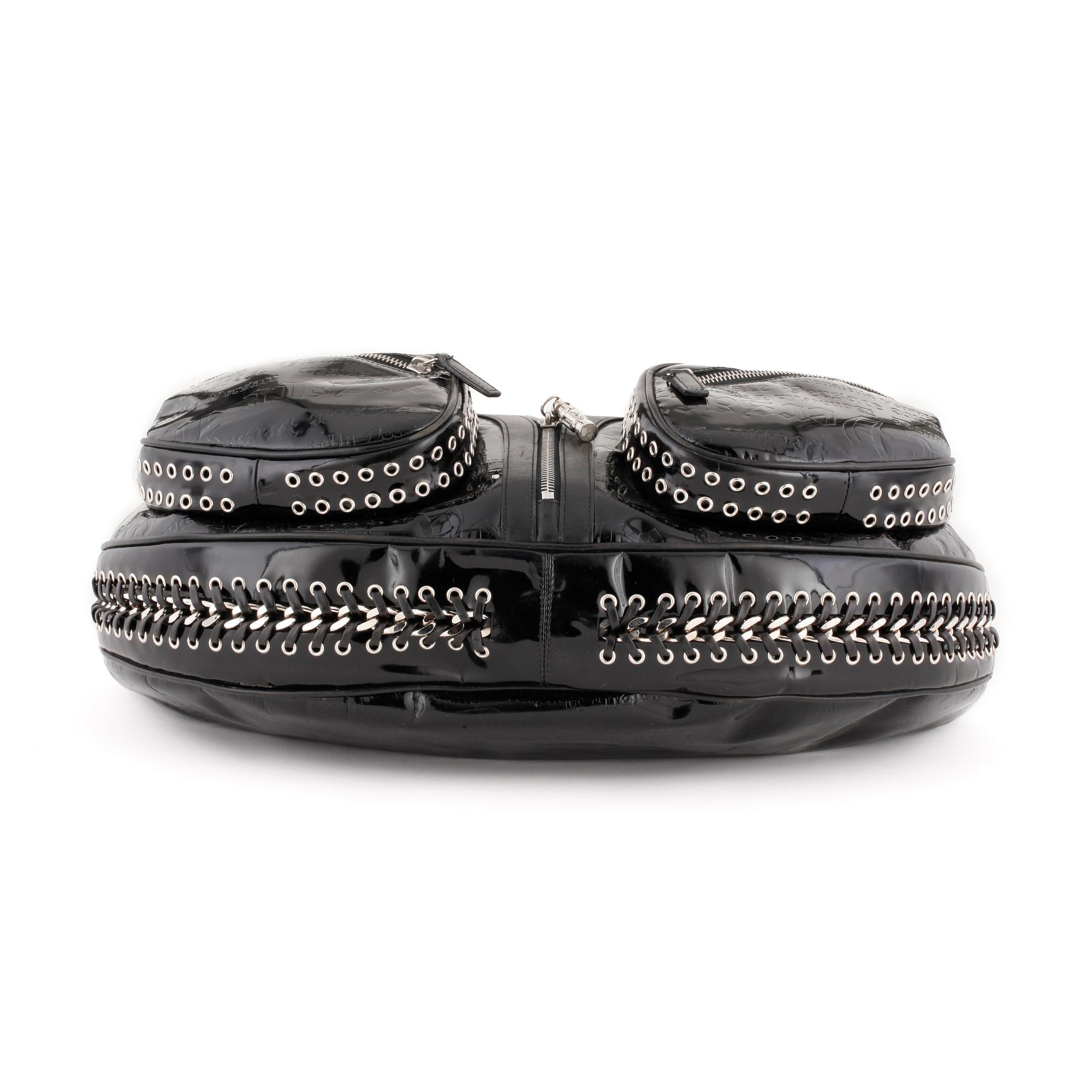 VERSACE, a black patented leather handbag.