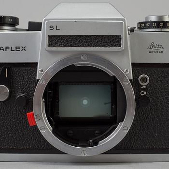 A chrome Leicaflex SL no nr  from 1284957 1971 with a black Elmarit-r  1:2.8 /135 lens no 2844073.