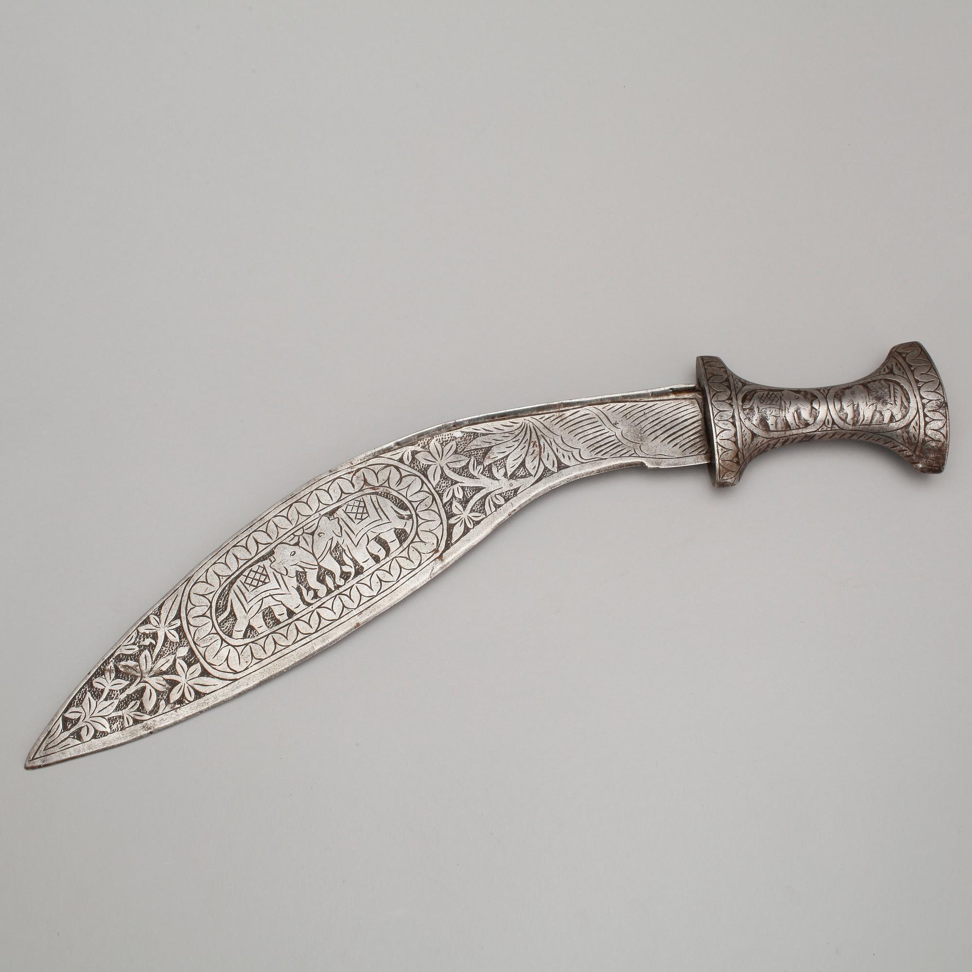 KUKRI samt YXA, indopersiska, stål, 1900-talets första hälft.