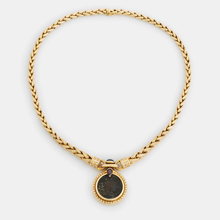 An 18K gold and ancient coin necklace set with a sapphire, a ruby and round brilliant-cut diamonds.