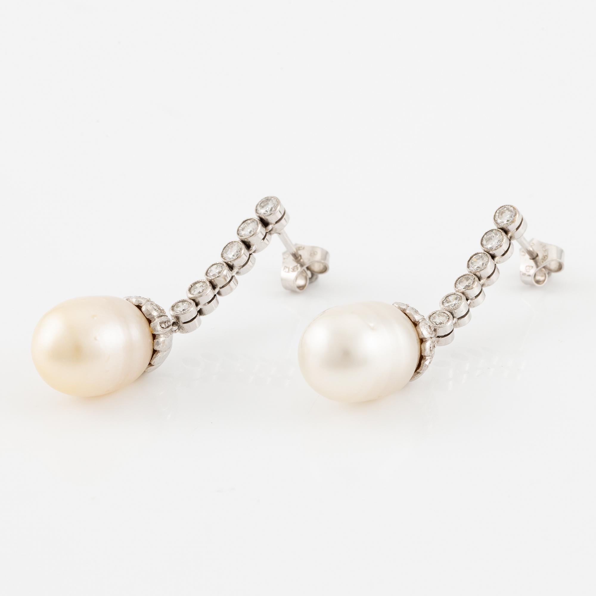 A pair of earrings in 18K white gold with cultured South Sea pearls and round brilliant-cut diamonds.
