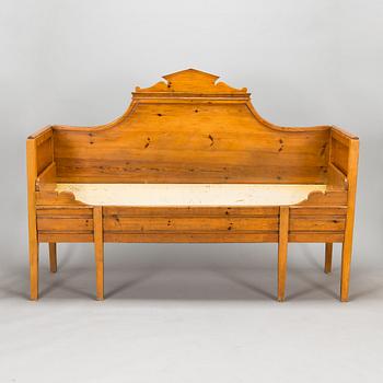 A wooden bed / sofa from around 1900.