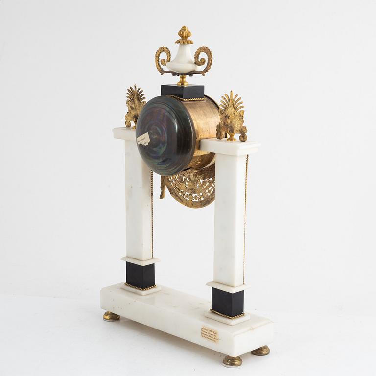 A French Louis XVI ormolu and marble portico clock, late 18th century.