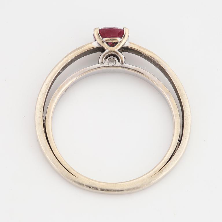 A tourmaline and brilliant cut diamond ring.
