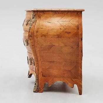 A brass-mounted and marquetry rococo commode, later part of the 18th century.
