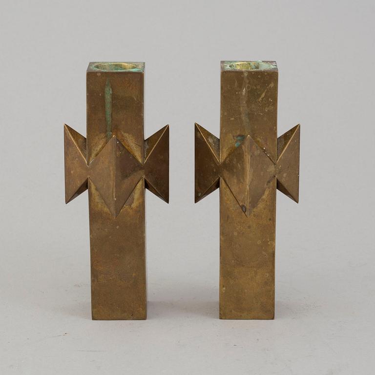 A pair of brass candlesticks by Pierre Forssell for Skultuna.