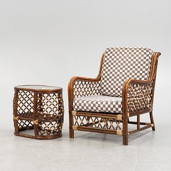 A rattan armchair and table, end of the 20th Century.