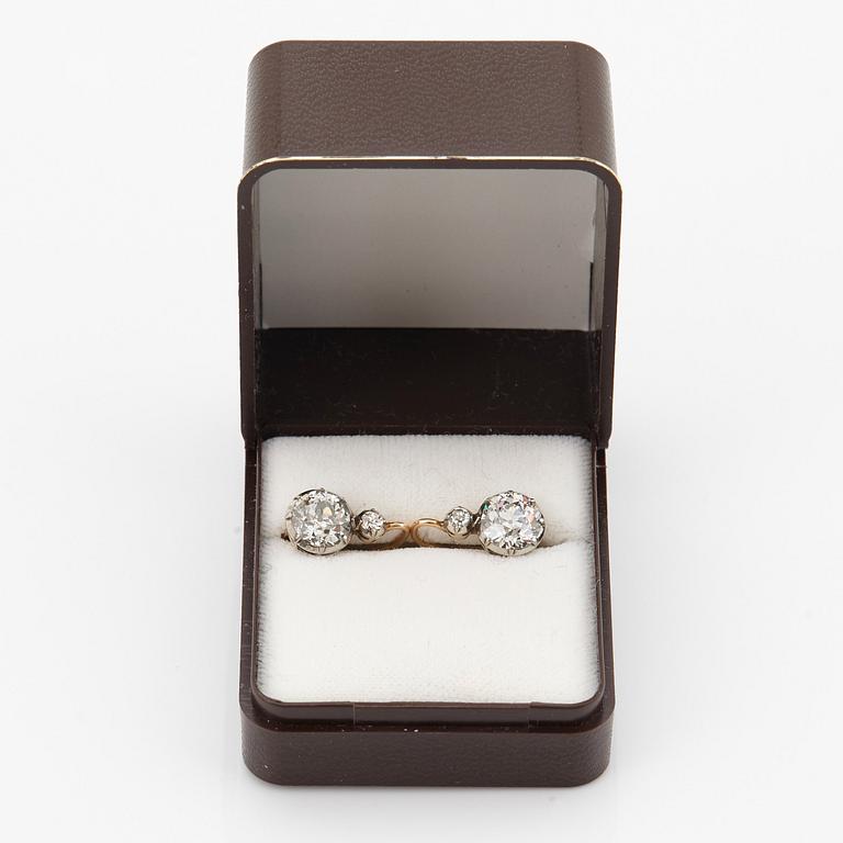 A pair of 14K gold earrings set with old-cut diamonds with a total weight of ca 2.50 cts.