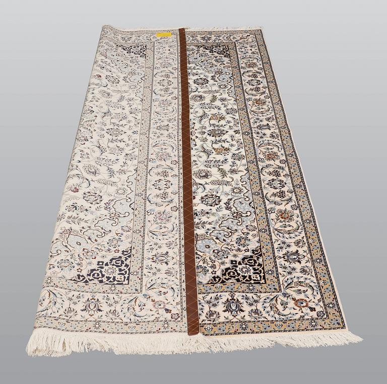 A carpet, Nain part silk so called 6 LAA, signed, ca 240 x 137 cm.