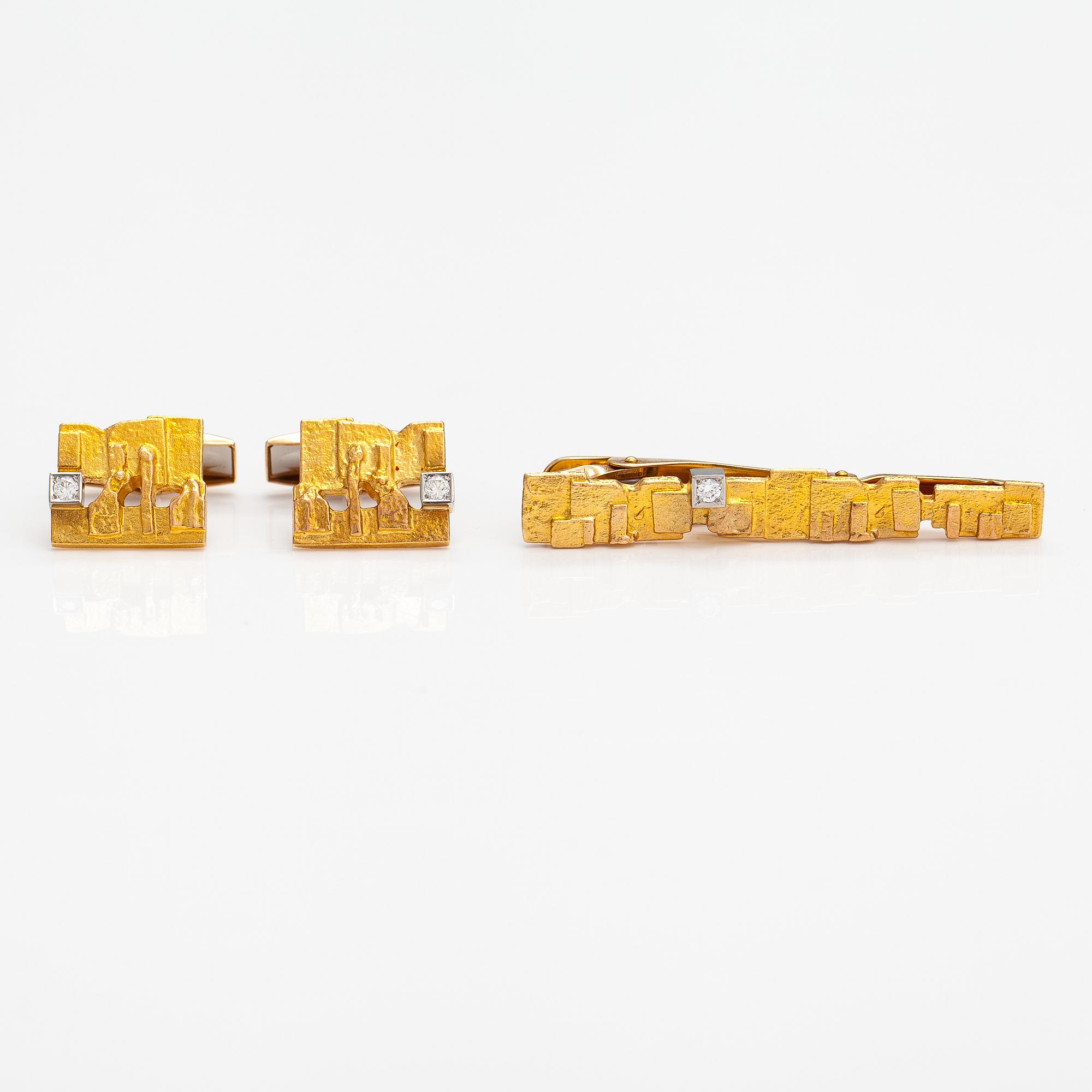 Björn Weckström, Solmioneula ja kalvosinnappipari "Jääriite", 14K kultaa, timantteja n. 0.18 ct yht. Lapponia.
