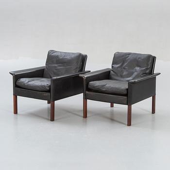 A pair of 1960s leather easy chairs.
