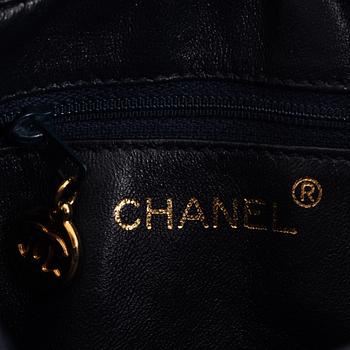 Chanel, a dark blue leather bag, 1991-1994.