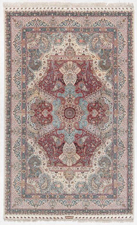 A Tabriz, carpet, 310 x 195 cm. signed.