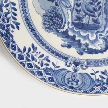 A pair of armorial dinner plates, soft paste, Qing dynasty, 18th century.