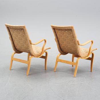A pair of 'Eva' easy chairs by Bruno Mathsson for Firma Karl Mathsson, dated 1974.