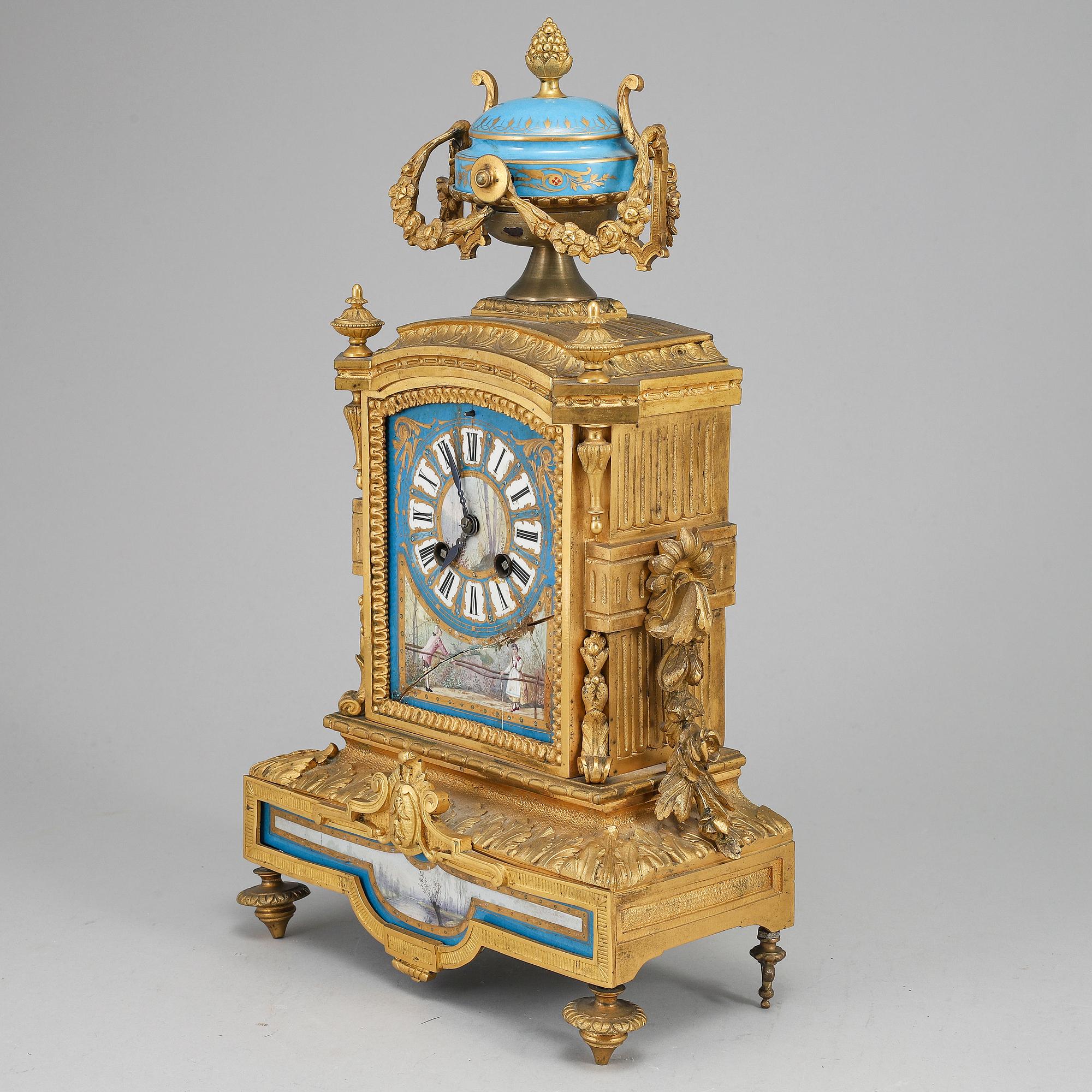 A late 19th Century bronze and porelain mantel clock.