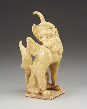 A yellow glazed pottery guardian, Tang dynasty (618-907).