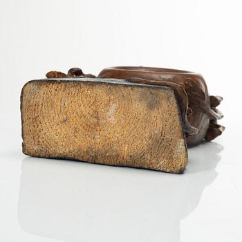 A carved pocket watch stand, Sweden, 19th century.