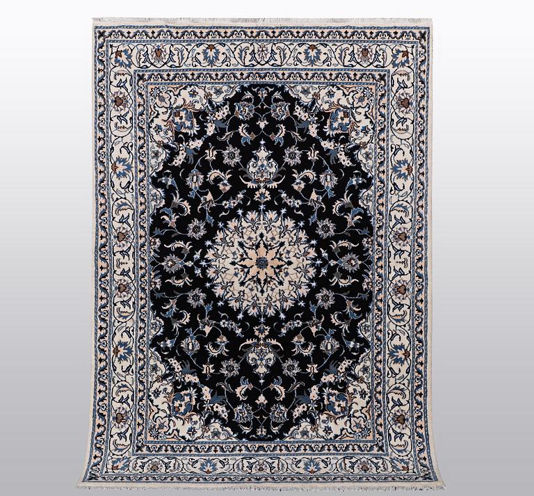 A rug, Nain, part silk, ca 242 x 167 cm.