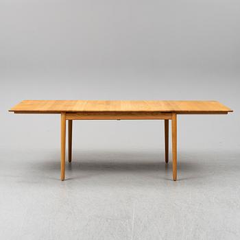 An oak dining table by Norrgavel.