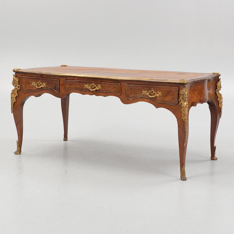 A French Louis XV-style rosewood marquetry 'Bureau plat aux bustes de femmes", late 19th century.