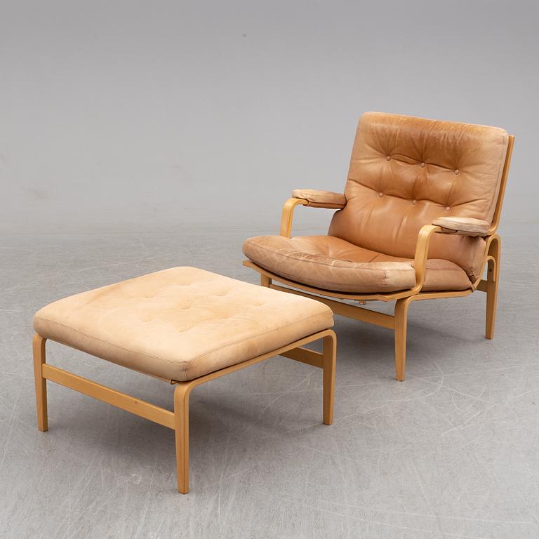 BRUNO MATHSSON, a pair of easy chairs with one stool.