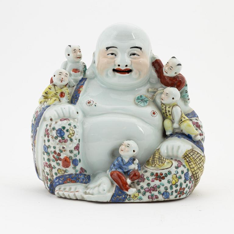 A porcelain 'Budai' figure, China, 20th Century.