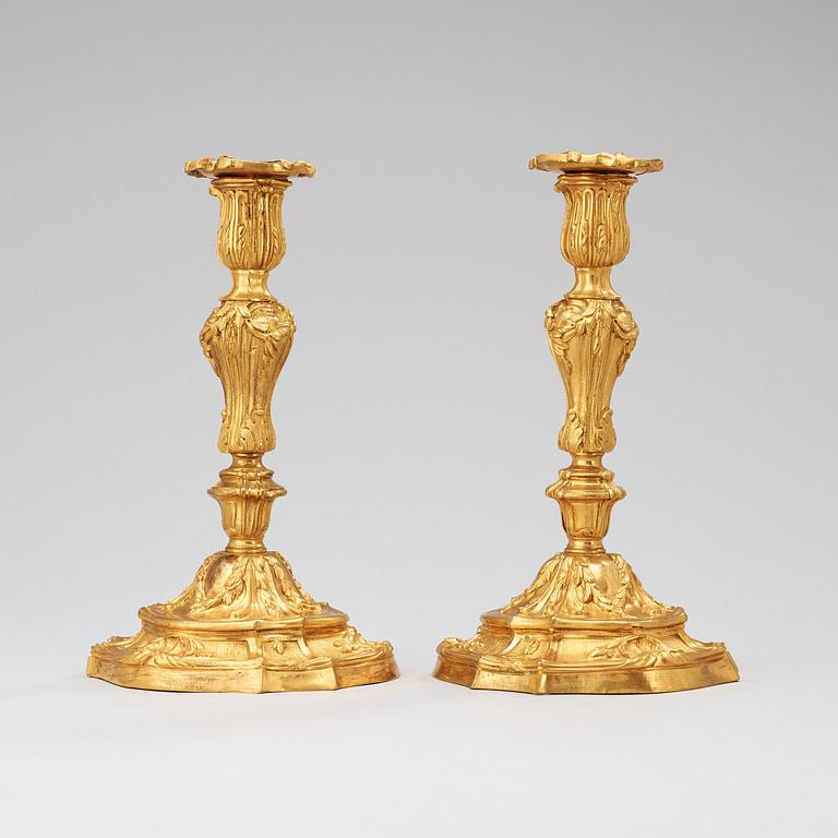A pair of Louis XV 18th century gilt bronze candlesticks.